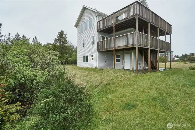 Back left side of home, 2 wrap around decks, able to put hot tub wired on 2nd floor off the primary room