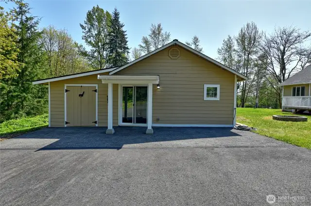 detached studio and large shed for yard equipment