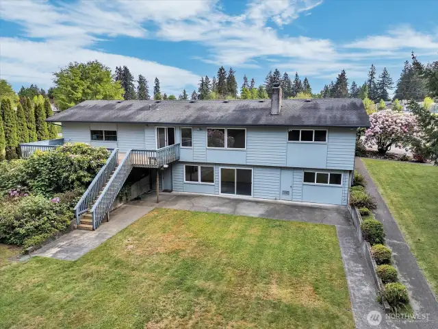 Second angle of rear of home via drone photo.