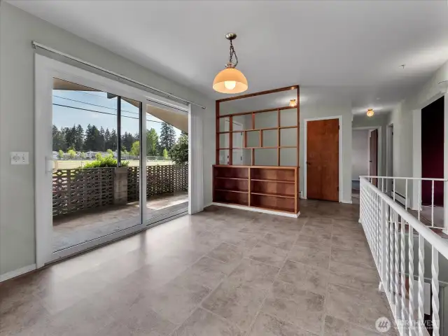 Oversized dining area with slider to the covered patio.