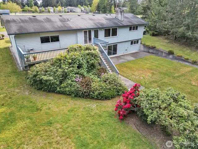 Third view of rear of home via drone.