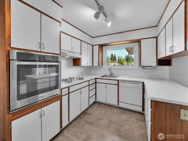 Stainless stove and serving bar.