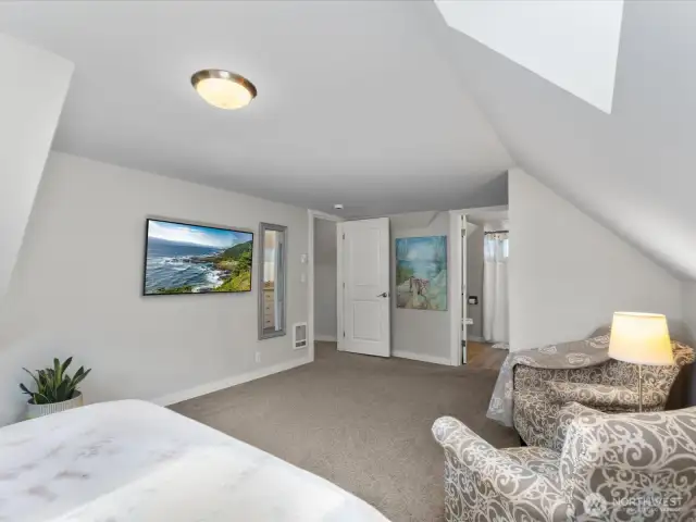 Primary bedroom has room for a sitting area.