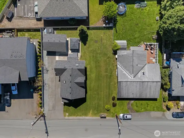 Garden shed behind garage does not convey.