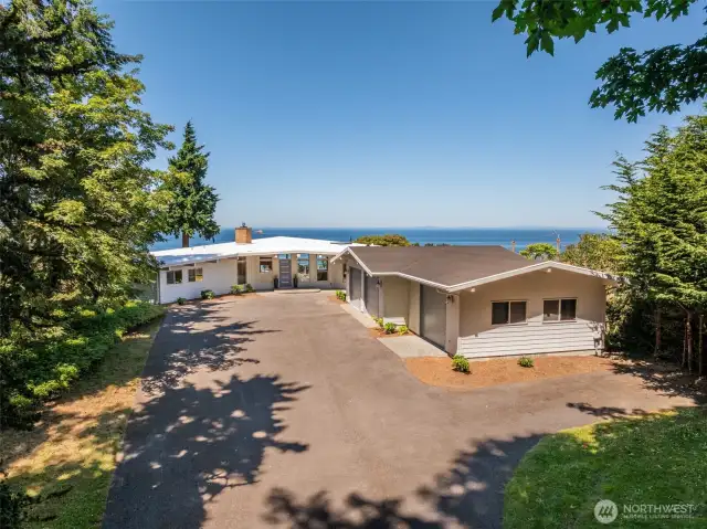 Hidden amongst the trees, this incredible house has unrivaled views!