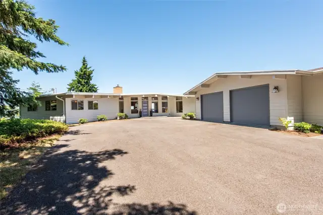 A huge asphalt driveway for all your friends!