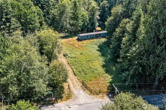 One full acre is cleared with a level home site ~