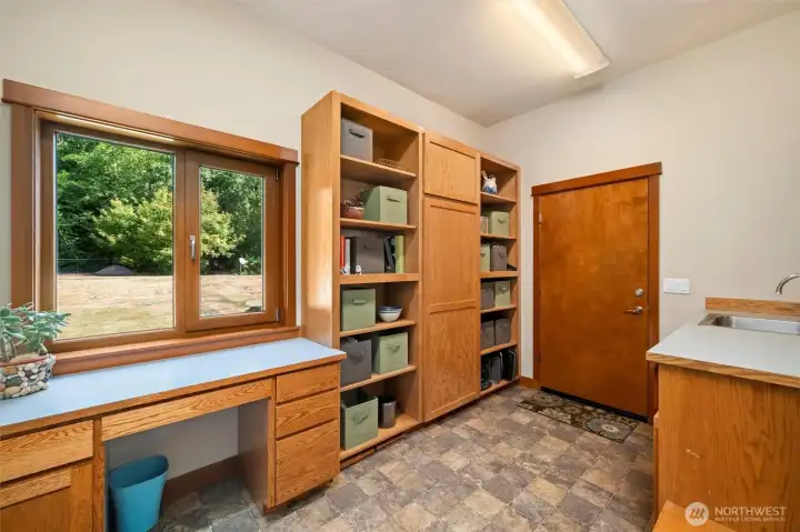 Amazing mudroom/pantry off entry area.  Door leads to oversized three car garage that has huge attic storage area.
