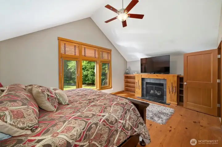 Upper level primary bedroom is spacious with vaulted ceilings and wonderful built ins.