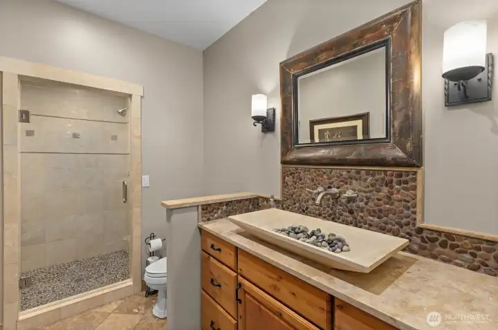 Guest bath on main floor with shower.