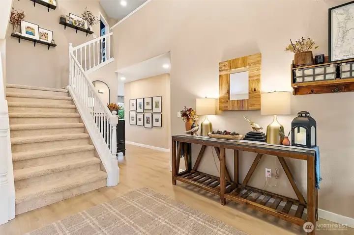 Grand wide staircase creates an impressive entry & enhances the homes open design.
