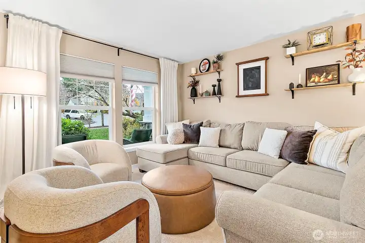 Formal living room just off the entryway offers an inviting first impression.