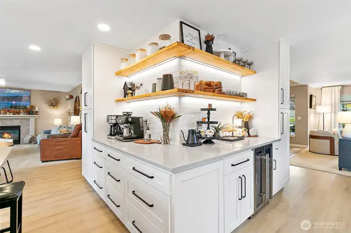 Seamless transition from the butler's buffet into the kitchen creates a built-in coffee bar --perfect for entertaining!