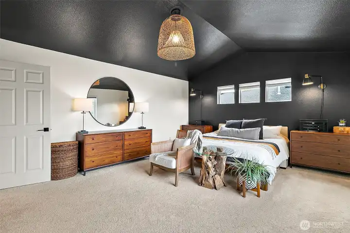 The primary suite is generously sized, offering plenty of space for a sitting area or retreat.