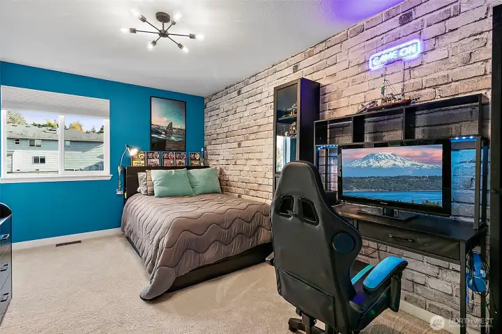 One of the generously sized bedrooms upstairs offering ample natural light.