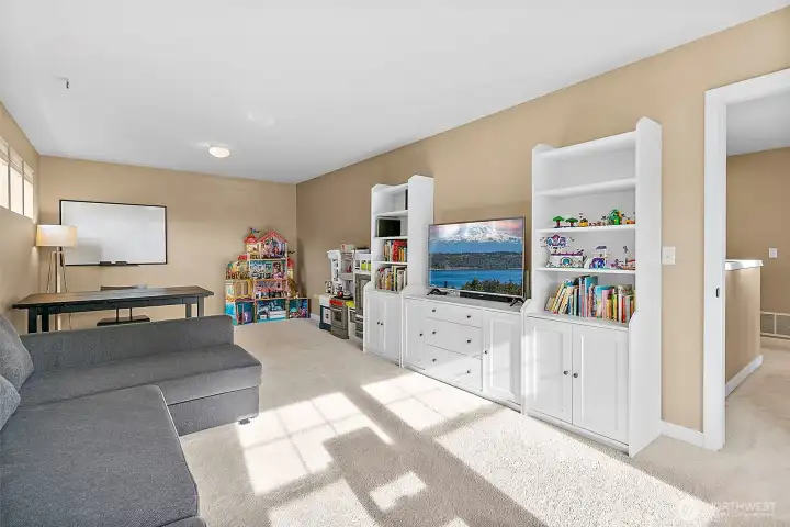Massive Bonus room upstairs offers endless possibilties- playroom, media room, home office , etc!