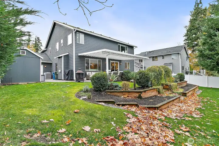 Spacious, tiered backyard features a sprinkler system and room to roam!