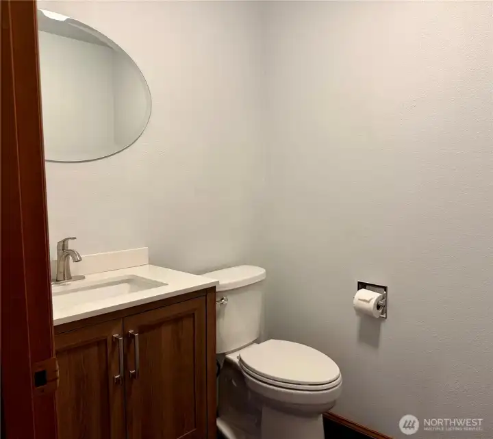 Updated bathroom by kitchen