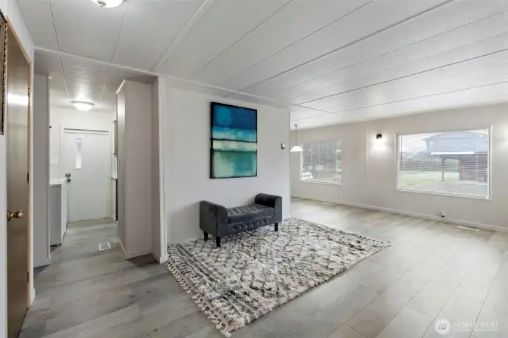 Living area with dining room in background