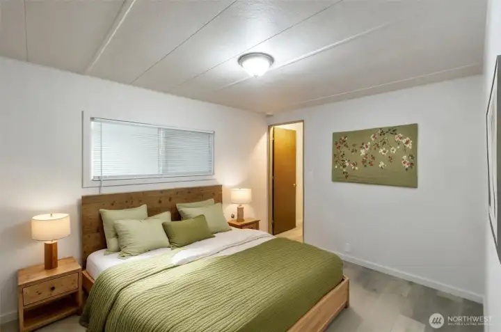 Bedroom 1 with walk in closet. Virtually staged