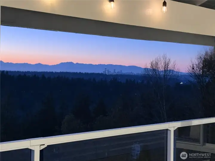 Twilight shot of the mountains and the sparkle of Down Town Seattle in the distance.