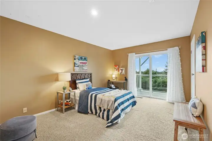 2nd Level - Bedroom 3.  Walk in Closet and access to deck. Spacious room.