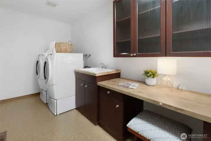 Large Laundry room with built in desk - great place for sewing crafting (or hiding away!)  - Not shown: additional shelving  & Whole house vacuum accessories