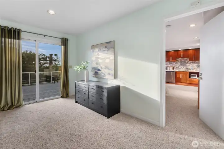 Level 3 - Landing.  A spacious entry from the large entertainment deck giving access to Studio Suite + Home Theater.