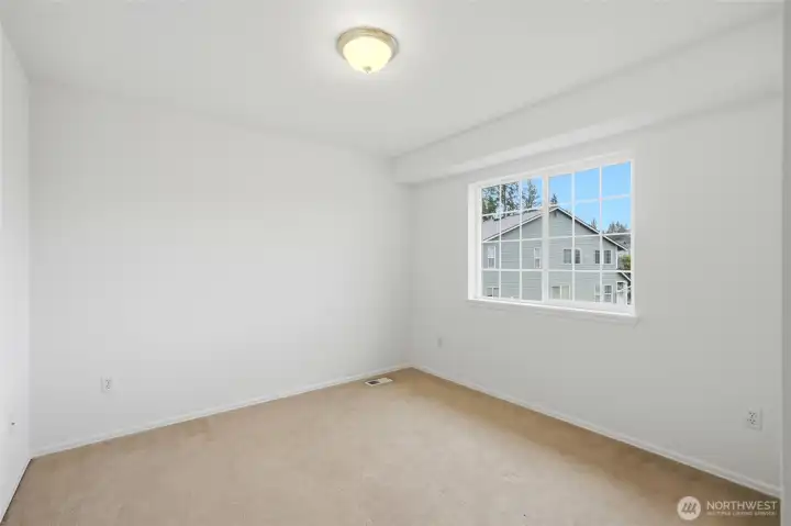 Secondary bedroom filled with natural light