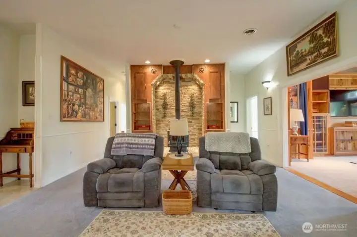 Living room off entry way. Entrance to theater room to the right.