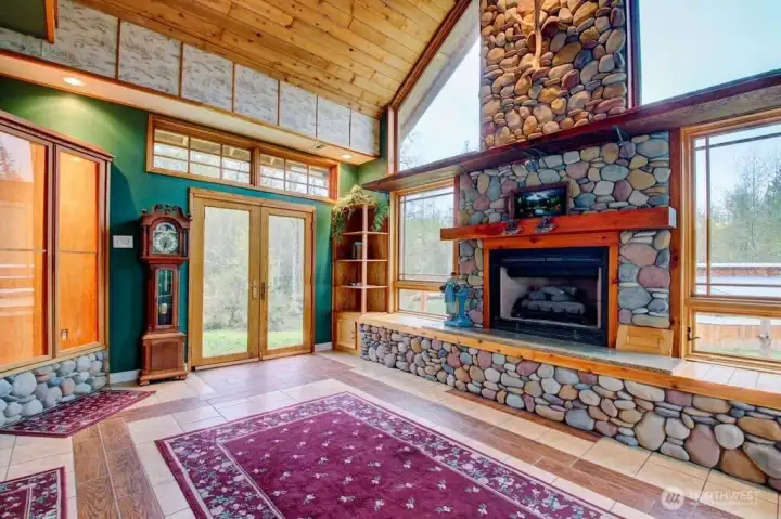 Another view of the great room with entry to the back yard. Built in corner cabinet with lighting.