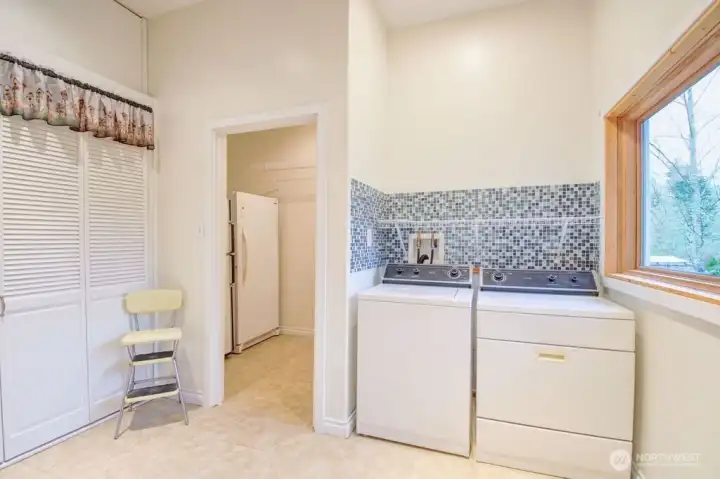 Laundry room with large walk in pantry.