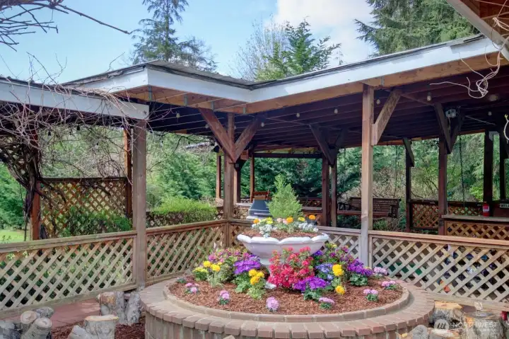 Front flower bed, Gazebo, and covered outdoor entertaining area.