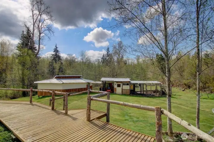 Walking deck w/railing. Shop and secured chicken run w/storage area.