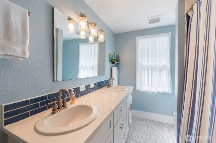 Enjoy the comfortability of a double sink in a nice sized bathroom. Enjoy the comfortability of a double sink in a nice sized bathroom.