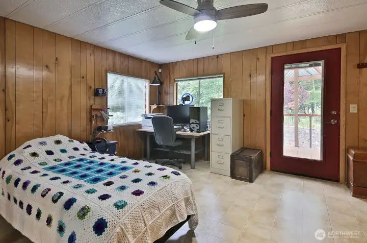 Primary Bedroom. The door leads out to the covered deck.