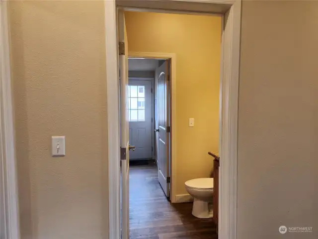 As we go we down the hallway, the guest bath has a door directly into the utility room and outside.