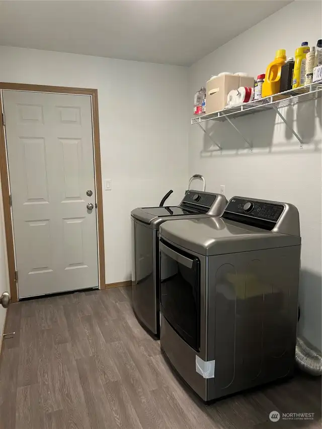 Laundry room leads to the large garage. Washer and dryer come with the house. All new appliances.