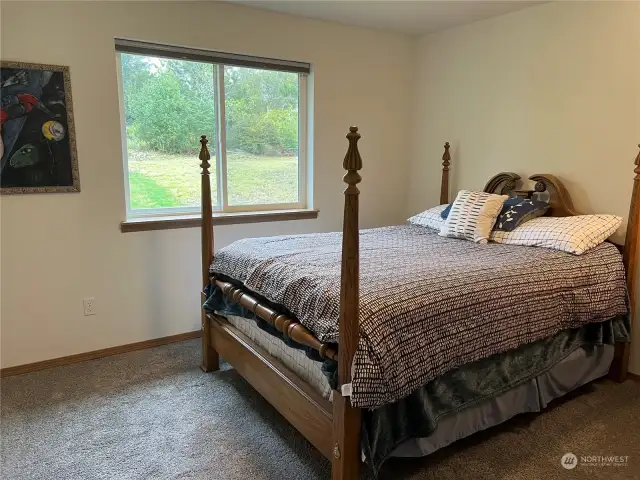 2nd bedroom faces east to the backyard.