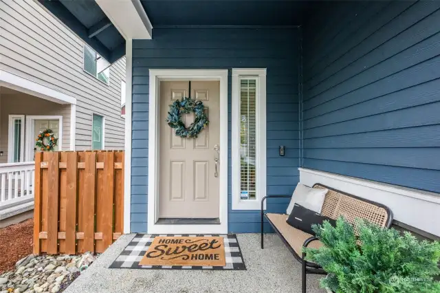 Picturesque covered front porch welcomes your guests