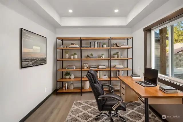 Virtually staged office/den on main floor of home