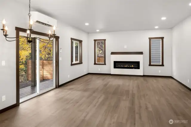 lliving room showing the slider door to back covered deck area and patio. Ample natural light flows into this home...