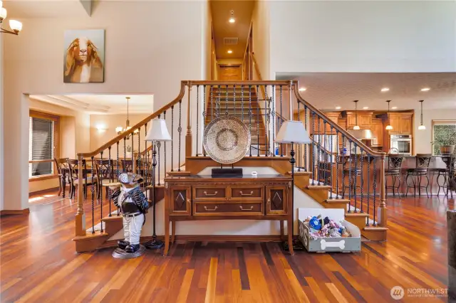 The wrought iron balusters' elegant curves harmonize with the arches featured in the architectural design.