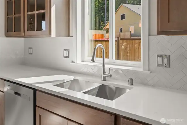 deep, undermounted stainless steel sink in kitchen