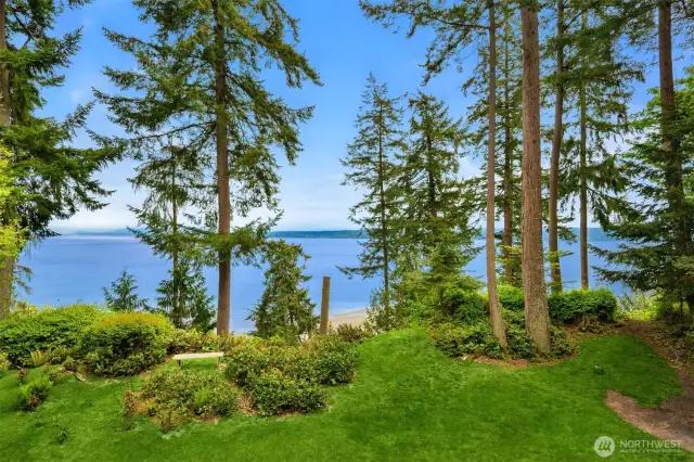 Trail takes you down to the stunning SANDY beach. The best of all worlds, privacy, park like setting, views and direct access to beach.