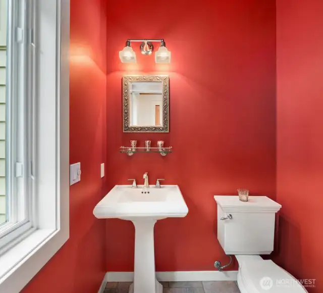 The powder room offers Kohler fixtures.