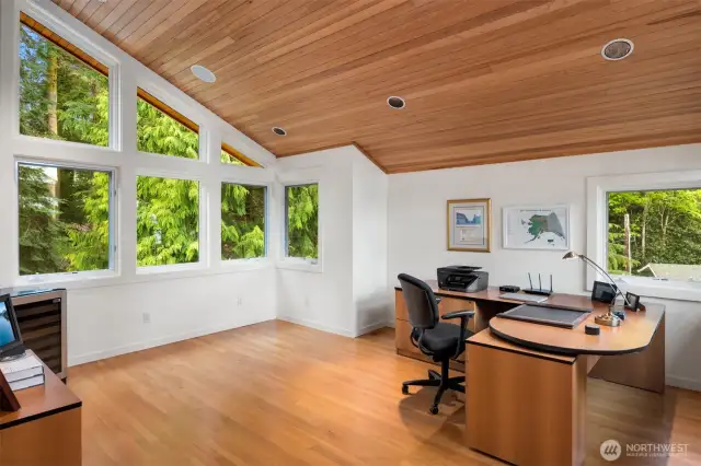 Who doesn't want to work from home in this office that has 3 WALLS of windows overlooking the water and mountain views.