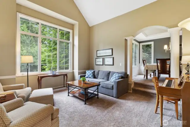 Vaulted ceilings and oversized windows bring both light and nature into the space.