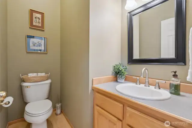 The main floor powder room, which is conveniently located between Living Rooms, Dining Rooms, Family Room and kitchen areas.