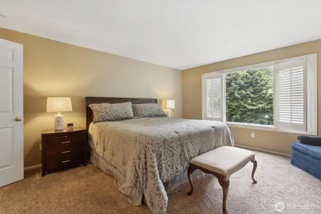 Then primary bedroom features double French doors